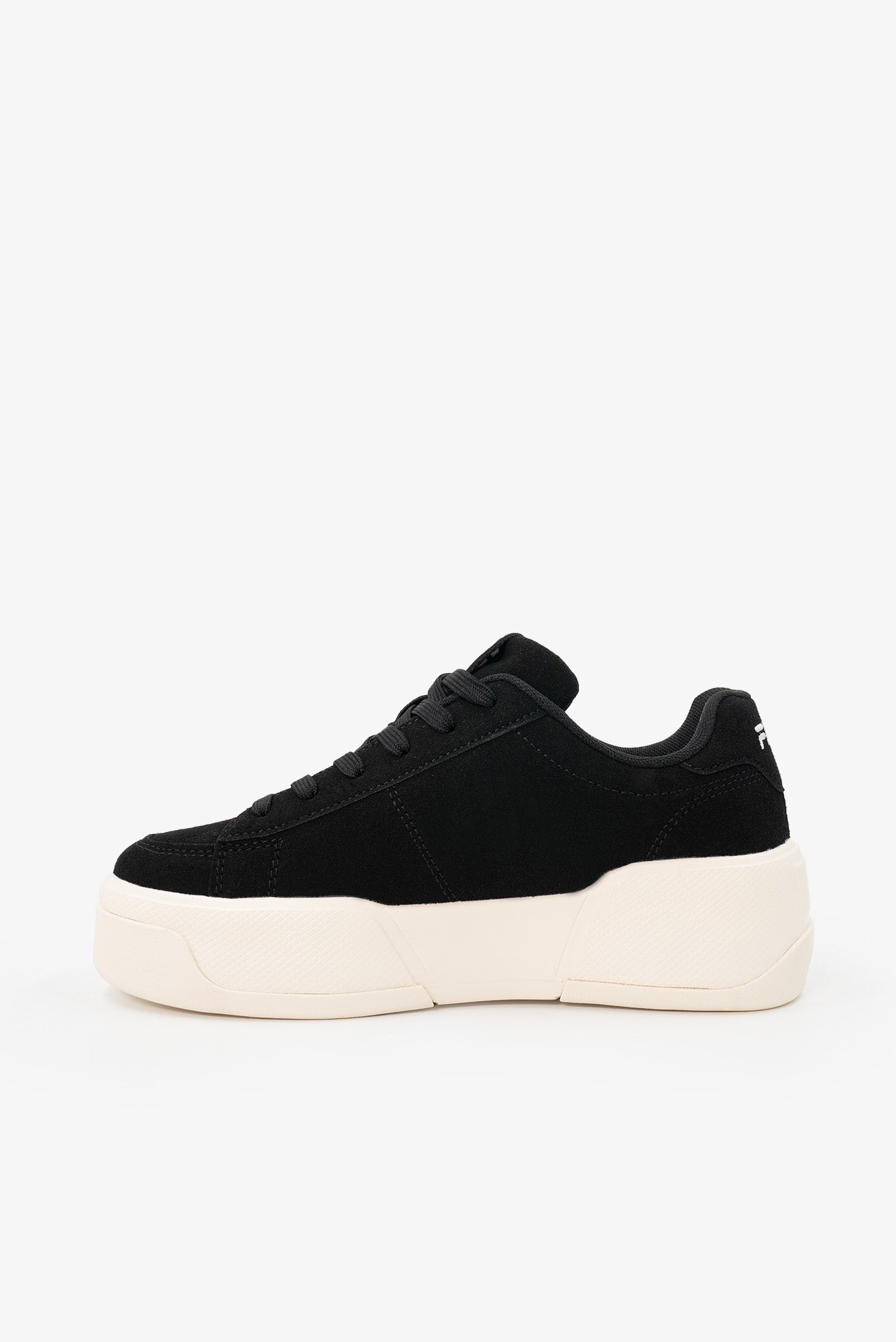 Black platform sneakers on a white background